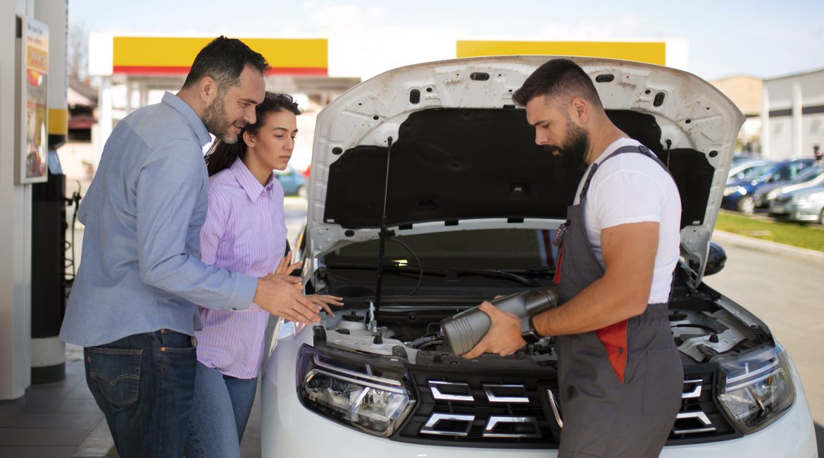 Vehicle inspection in Chile showing automotive battery replacement signs