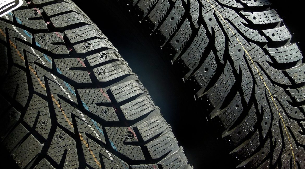 Close-up view of two PCR tire tread patterns showing detailed grooves, sipes, and directional design for enhanced traction and safety.