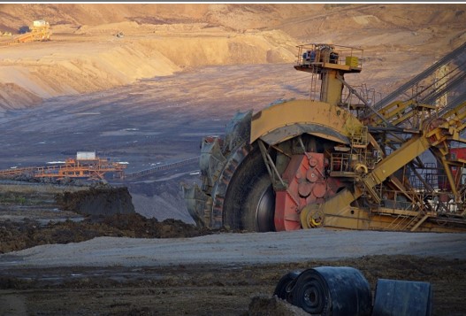 Heavy-duty mining equipment operating in an open-pit mine, highlighting the importance of tire quality in the mining industry